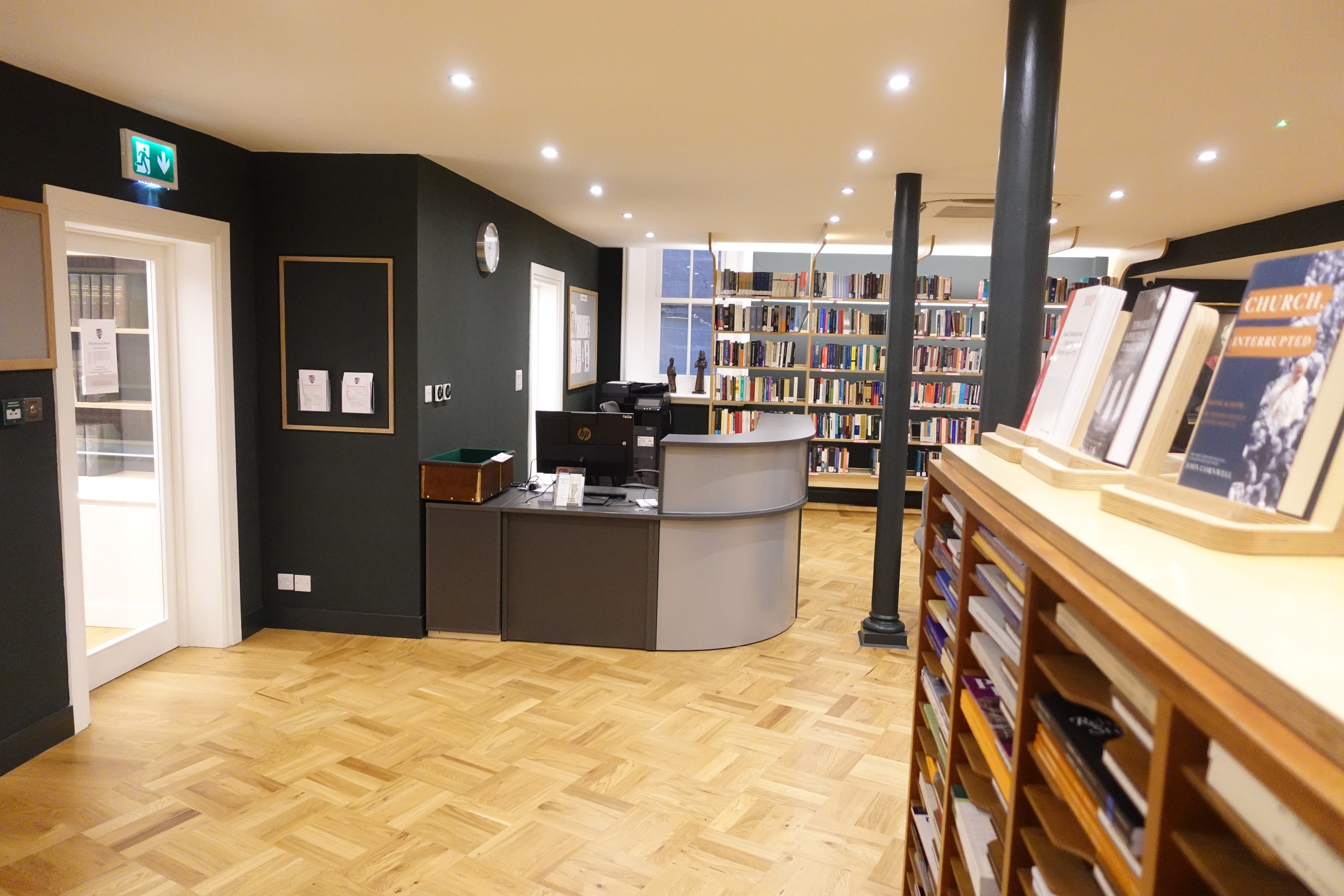 Showing the staff desk and some part of the reading room.
